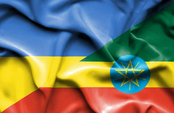 Waving flag of Ethiopia and Ukraine — Stok fotoğraf