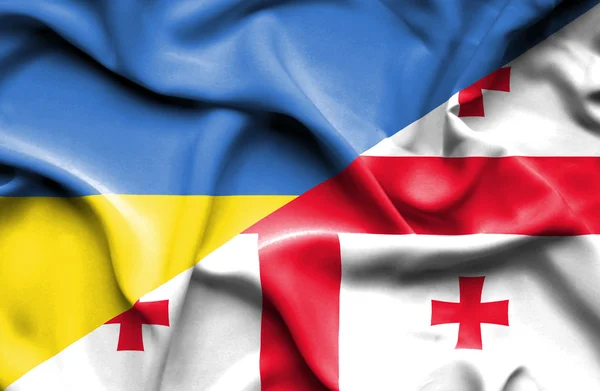 Waving flag of Georgia and Ukraine — Stock fotografie