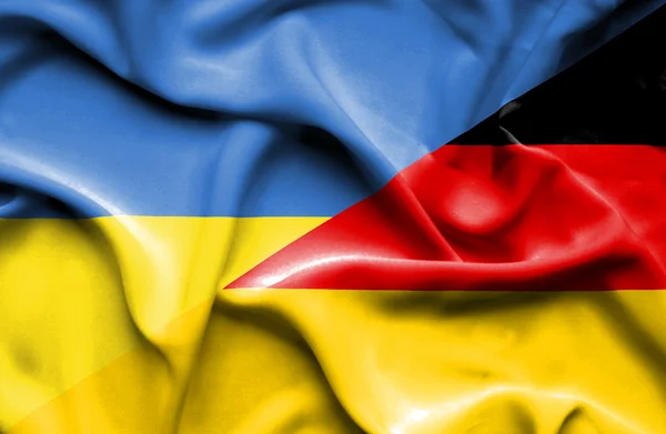 Waving flag of Germany and Ukraine — 图库照片