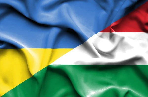 Waving flag of Hungary and Ukraine — Zdjęcie stockowe