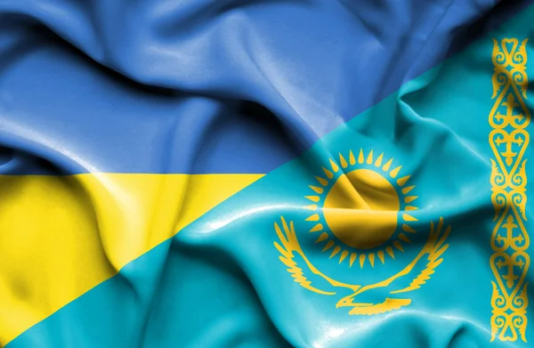 Waving flag of Kazakhstan and Ukraine — Stok fotoğraf