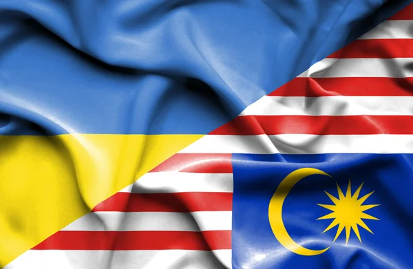 Waving flag of Malaysia and Ukraine — Stock Photo, Image