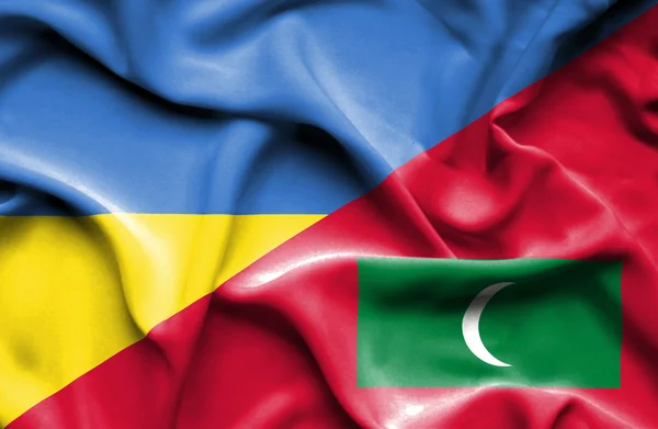 Waving flag of Maldives and Ukraine — Stock Photo, Image