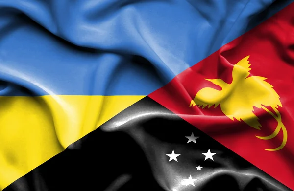 Waving flag of Papua New Guinea and Ukraine — 图库照片