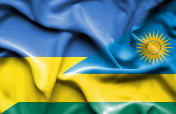 Flagge Ruandas und der Ukraine schwenken — Stockfoto
