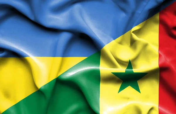 Mávání vlajkou Senegalu a na Ukrajině — Stock fotografie