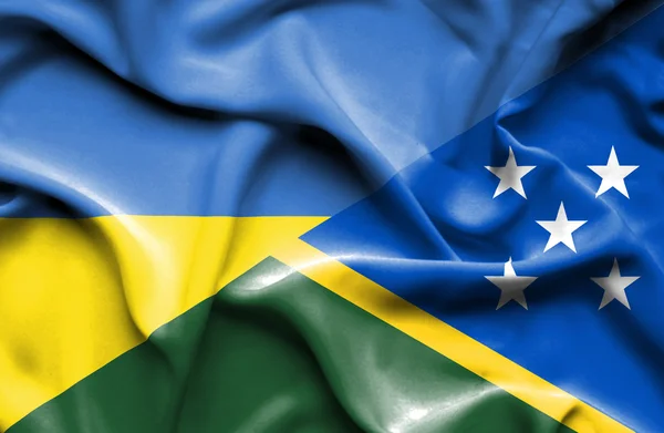 Salomonøyenes og Ukrainas flagg – stockfoto