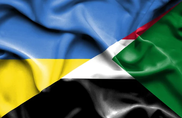 Waving flag of Sudan and Ukraine — Stock Photo, Image