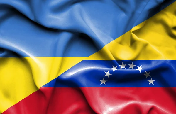 Flagge von venezuela und ukraine schwenken — Stockfoto