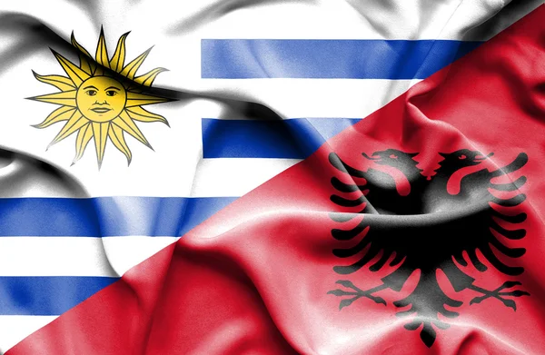 Bandera ondeante de Albania y Uruguay — Foto de Stock