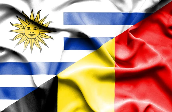 Waving flag of Belgium and Uruguay — 图库照片