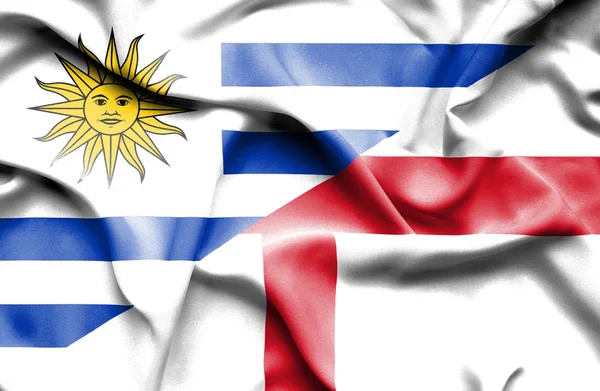 Waving flag of England and Uruguay — Φωτογραφία Αρχείου