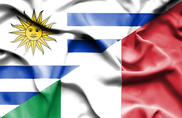 Waving flag of Italy and Uruguay — Zdjęcie stockowe