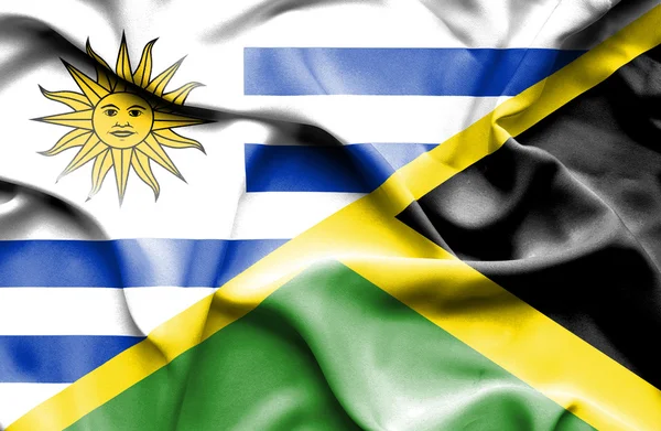 Waving flag of Jamaica and Uruguay — Stock Photo, Image