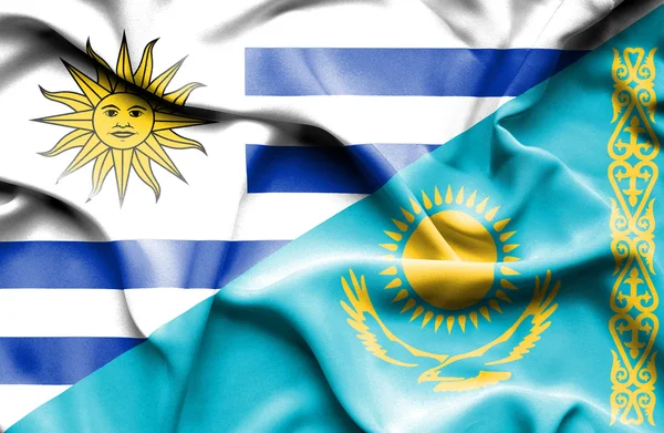 Bandera ondeante de Kazajstán y Uruguay —  Fotos de Stock