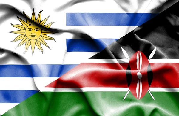 Waving flag of Kenya and Uruguay — Stockfoto