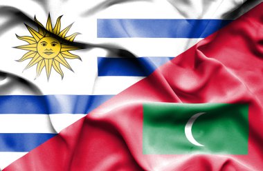 Maldivler ve uruguay bayrağı sallayarak