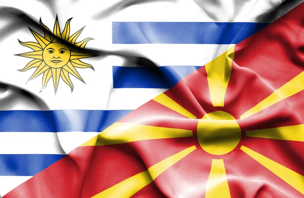 马其顿和乌拉圭那飘扬的旗帜 — 图库照片