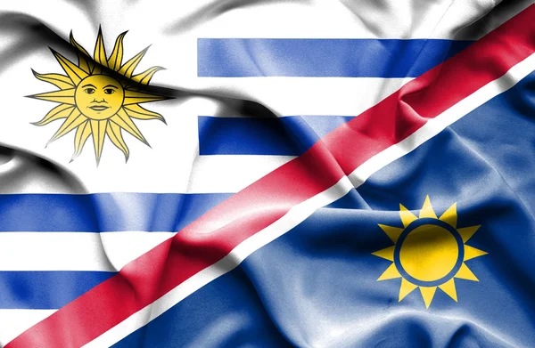 ナミビア、ウルグアイの旗を振っています。 — ストック写真