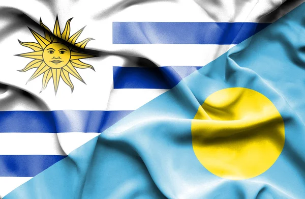 Waving flag of Palau and Uruguay — Stock Photo, Image