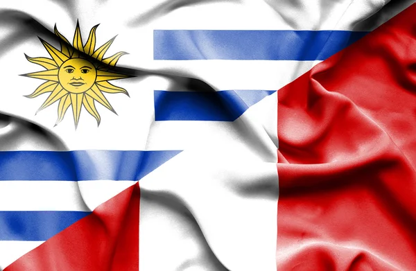 Waving flag of Peru and Uruguay — Stock Photo, Image
