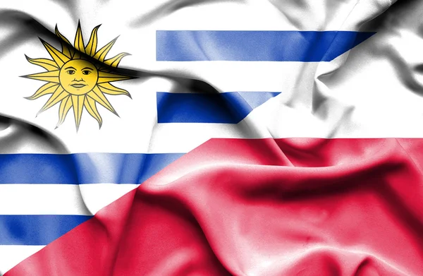 Flagge von Polen und Uruguay schwenken — Stockfoto