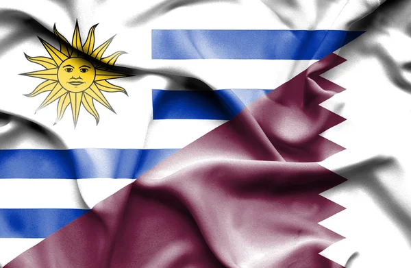 Bandera ondeante de Qatar y Uruguay —  Fotos de Stock