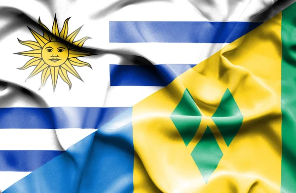 Wehende Fahne des Heiligen Vincent und Granadinen und Uruguay — Stockfoto