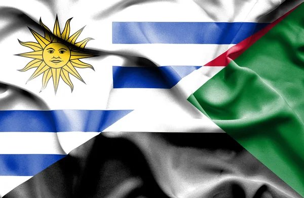 Bandera ondeante de Sudán y Uruguay — Foto de Stock