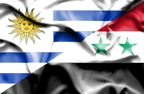 Waving flag of Syria and Uruguay — Zdjęcie stockowe