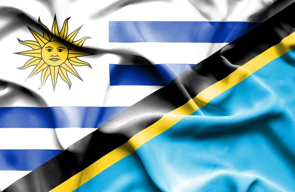 Waving flag of Tanzania and Uruguay — Stock Photo, Image