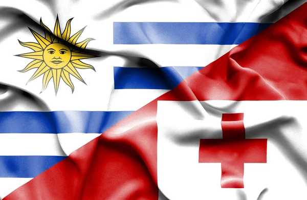 Waving flag of Tonga and Uruguay — Stock Photo, Image
