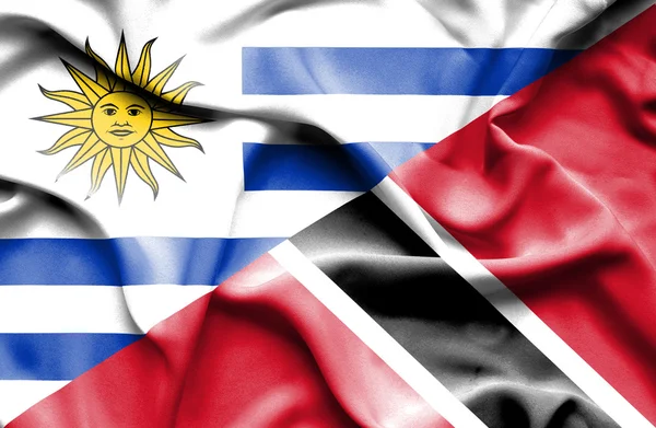 Waving flag of Trinidad and Tobago and Uruguay — Stock Photo, Image