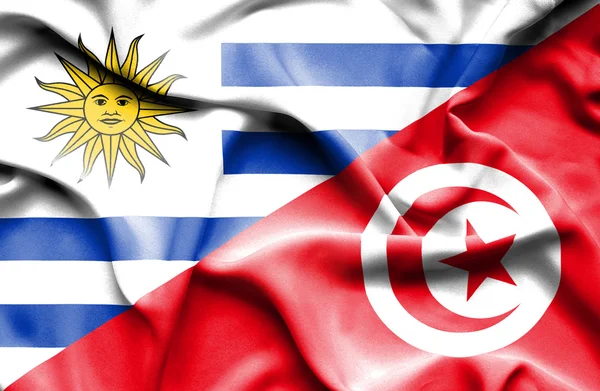 Flagge von Tunis und Uruguay schwenken — Stockfoto