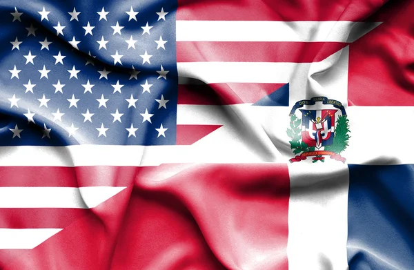 Viftande flagga Dominikanska republiken och usa — Stockfoto