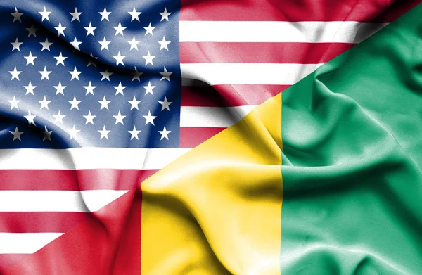 Waving flag of Guinea and USA — Stock Photo, Image