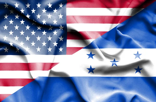 Wapperende vlag van honduras en Verenigde Staten — Stockfoto