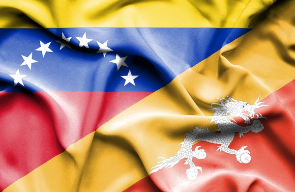 Waving flag of Bhutan and Venezuela — Stockfoto