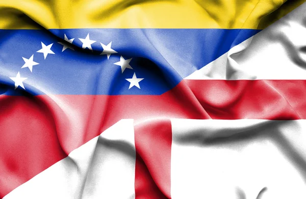 Ondeando la bandera de Inglaterra y Venezuela — Foto de Stock