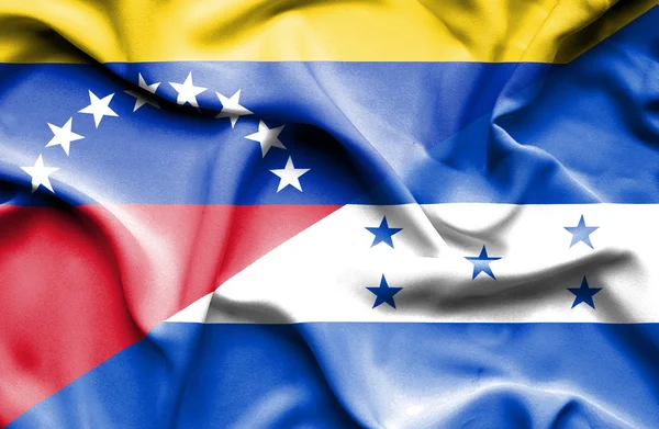 Waving flag of Honduras and Venezuela — Stockfoto