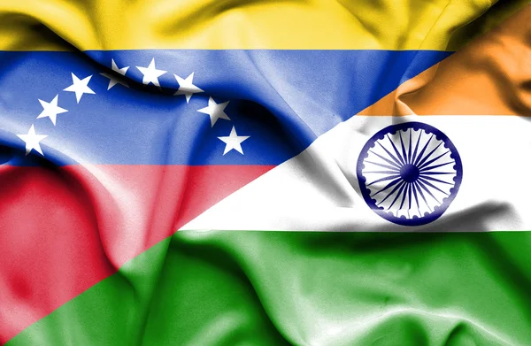 Waving flag of India and Venezuela — Stockfoto