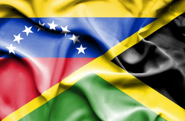 Waving flag of Jamaica and Venezuela — Zdjęcie stockowe