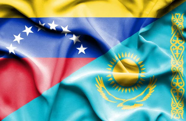 Waving flag of Kazakhstan and Venezuela — Stockfoto