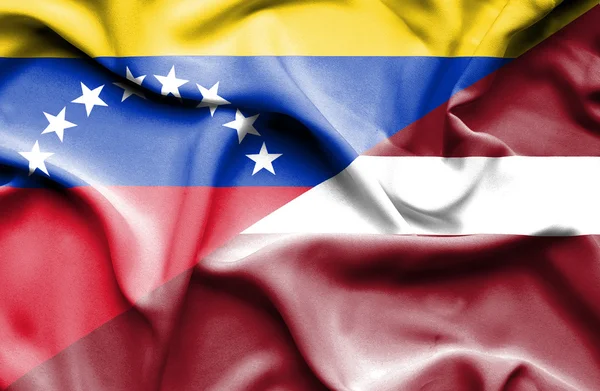 Waving flag of Latvia and Venezuela — Stock Photo, Image