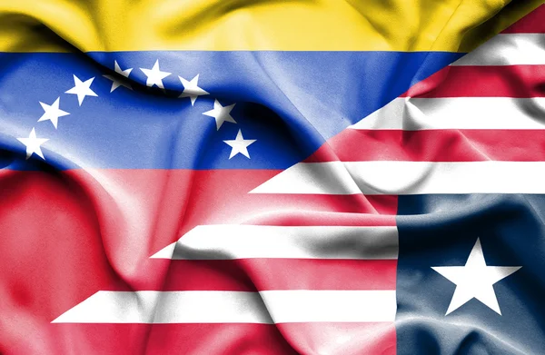 Waving flag of Liberia and Venezuela — Stock Photo, Image