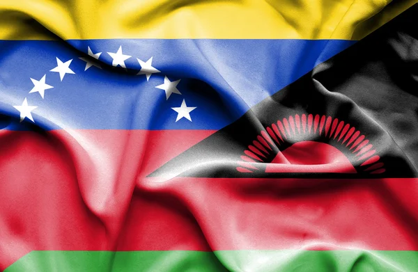 Waving flag of Malawi and Venezuela — Stockfoto