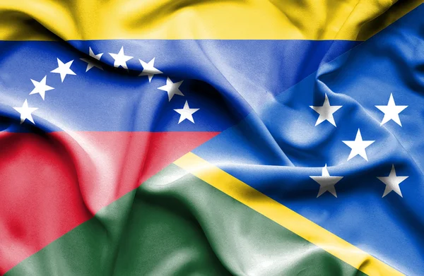 Vlající vlajka Šalamounových ostrovů a venezuela — Stock fotografie