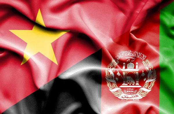 Waving flag of Afghanistan and Vietnam — Stockfoto