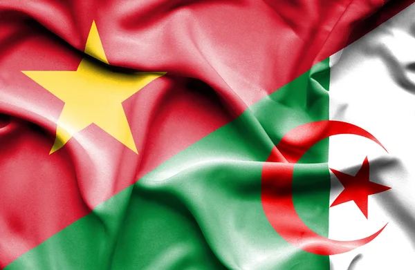 Waving flag of Algeria and Vietnam — Stockfoto