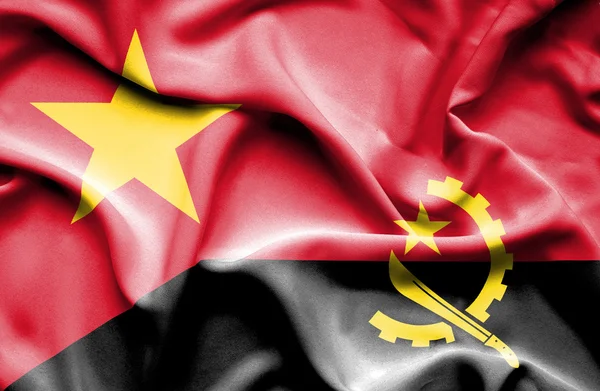 Waving flag of Angola and Vietnam — Stok fotoğraf